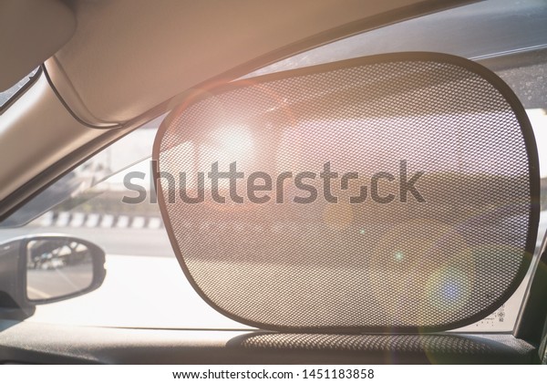 Sun Shade of\
Side Window car in warm day\
time
