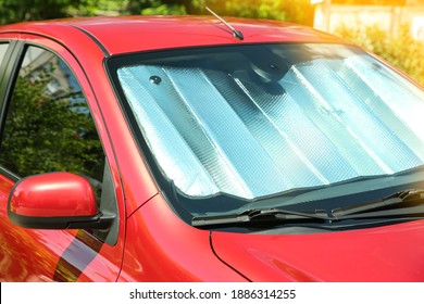 Sun Shade Under Windshield In Car, Closeup. Heat Protection