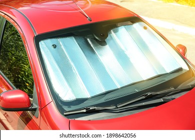 Sun Shade Under Windshield In Car, Closeup. Heat Protection