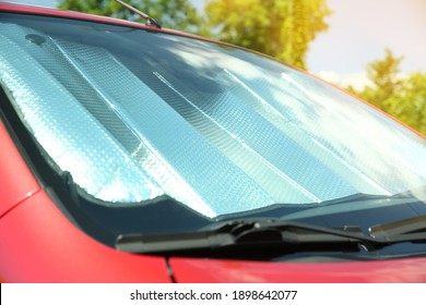 Sun Shade Under Windshield In Car, Closeup. Heat Protection