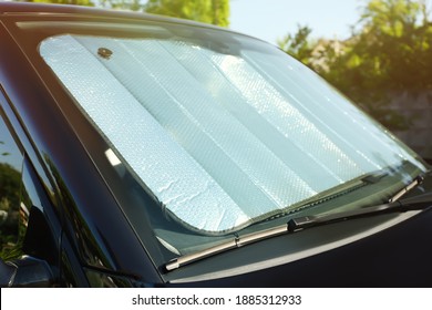 Sun Shade Under Windshield Inside Car, Closeup. Heat Protection