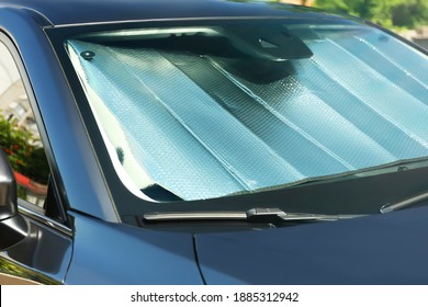 Sun Shade Under Windshield Inside Car, Closeup. Heat Protection