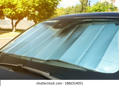 Sun Shade Under Windshield Inside Car, Closeup. Heat Protection