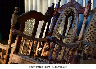 Sun And Shadows On Intricate Broken Rocking Chair.