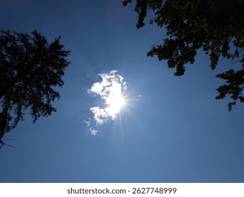 sun shines through a cloud