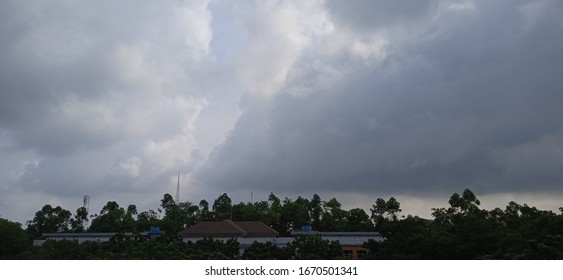 The sun is shining behind the clouds