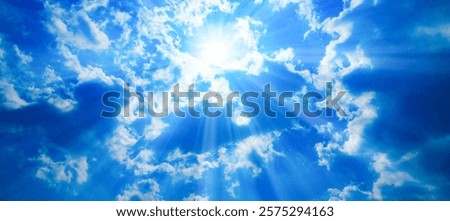 The sun shining in the blue sky