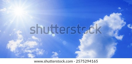 The sun shining in the blue sky