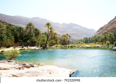 Sun shining on beautiful desert lake oasis of Wadi Bani Khalid in Oman