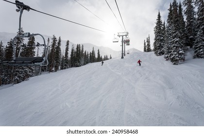 Sun Shining On The Ski Slope With Chairlift, Colorado Mountains