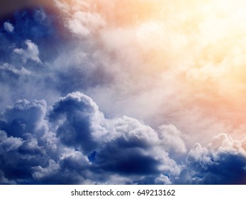 sun shining on stormy clouds from the top, toned - Shutterstock ID 649213162