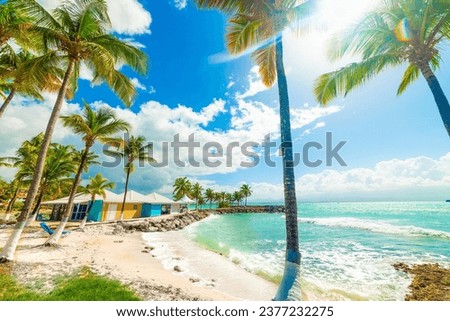 Sun shining over beautiful Bas du Fort beach in Guadeloupe, French west indies. Lesser Antilles, Caribbean sea