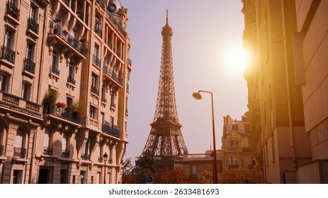 Sun shining over the Eiffel Tower framed by Parisian buildings at sunset