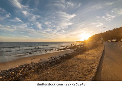 Sun shining over Pacific Coast Highway in Malibu at sunset. California, USA - Powered by Shutterstock