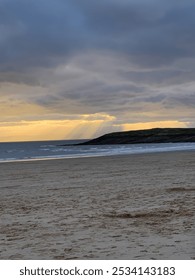Sun Shining Through Cloud Cover at Beach