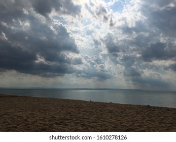 Sun Shining Through The Clouds