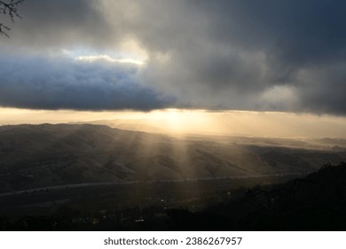 sun shining through the clouds