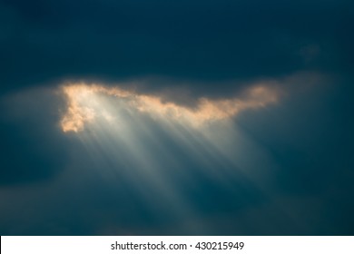 Sun Shining Through The Clouds