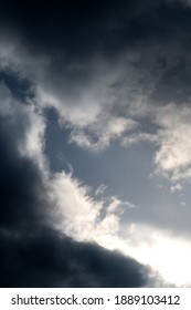 The Sun Shining Through The Dark Clouds In The Sky After A Storm In Winter