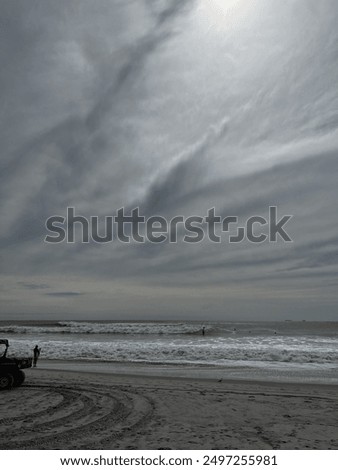 Sun shining through a layer of clouds over Atlantic Ocean 