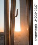 sun shining  through the open window on the balcony