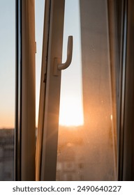 sun shining  through the open window on the balcony