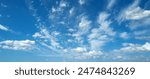 Sun shining through the puffy clouds. Sky view. Beautiful sunny sky. Background with clouds on blue sky. Clouds on blue sky.