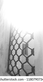 sun shining in a window grille