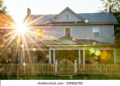 Sun Star And Reflection On A Country Home In The South