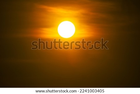 The sun at sundown. Sunset sky background