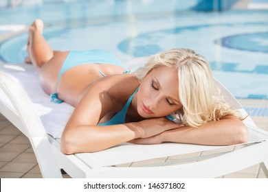 Sun Tanning. Beautiful Young Women In Bikini Lying On The Deck Chair With Her Eyes Closed