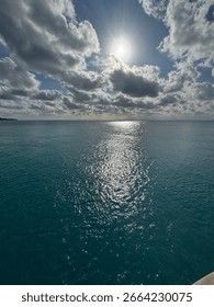Sun through clouds over the ocean