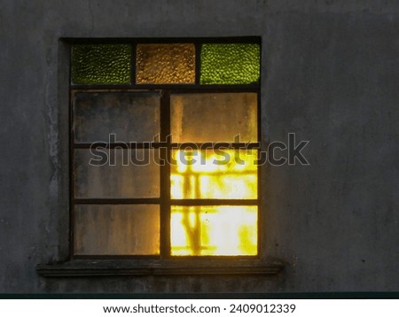 sun through the couloured window