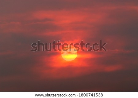 sun through smoke from wildfire