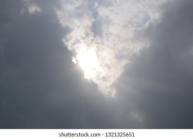 the sun through thunderclouds
