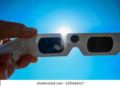 Sun Viewed Behind Darkened Solar Eclipse Glasses