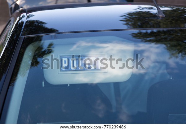 sun visor in a car with\
marked police