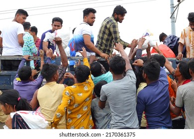 Sunamganj, Sylhet Division, Bangladesh - 21 June 2022: Flood Victims Collect Food From A Relief Vehicle.