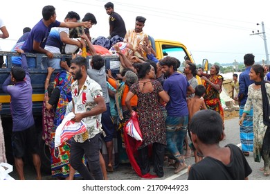 Sunamganj, Sylhet Division, Bangladesh - 21 June 2022: Flood victims collect food from a relief vehicle.