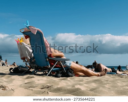 Sunbathing on the beach during summer vacation, relaxing holiday concept with warm sunlight, leisure time, travel freedom and seaside lifestyle atmosphere