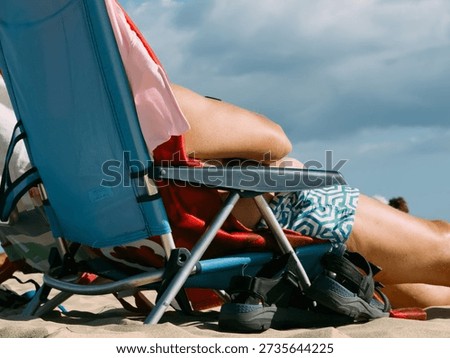 Sunbathing on the beach during summer vacation, relaxing holiday concept with warm sunlight, leisure time, travel freedom and seaside lifestyle atmosphere
