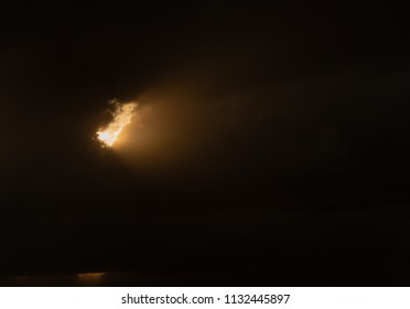 sunbeam behind clouds