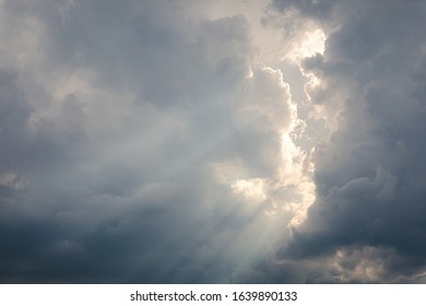 Sunbeam between storm clouds cloudscape sky view