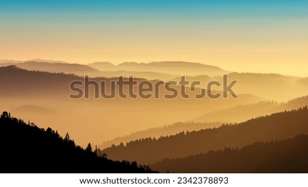 Sunbeams break through the mist, casting a golden glow over surrounding hills.