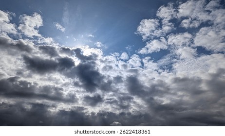 Sunbeams pierce dramatic cloudscape breathtaking celestial beauty
