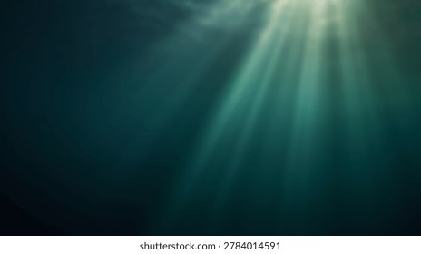 Sunbeams pierce through the surface of deep, dark blue-green ocean water, casting visible light rays into the mysterious and serene underwater environment.