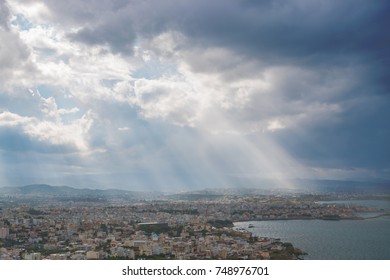 Sunbeams shining through the dramatic clouds over the city Chania. Greece. Crete. - Powered by Shutterstock