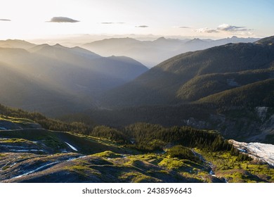 Sunbeams shining through fog filled valleys in the Cascade mountains in Washington - Powered by Shutterstock