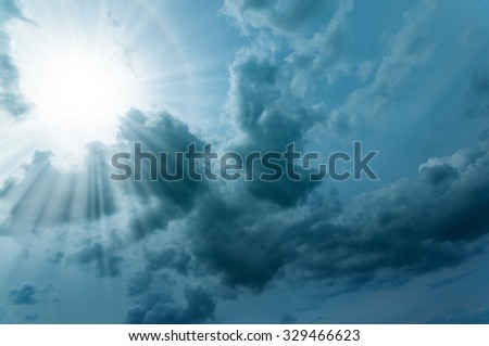 Sunbeams through dark cloudscape; Enlightenment