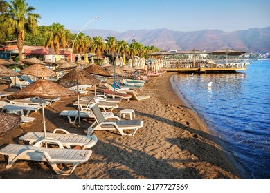 Sunbeds and umbrellas on the sea beach, Marmaris, Turkey - Shutterstock ID 2177727569